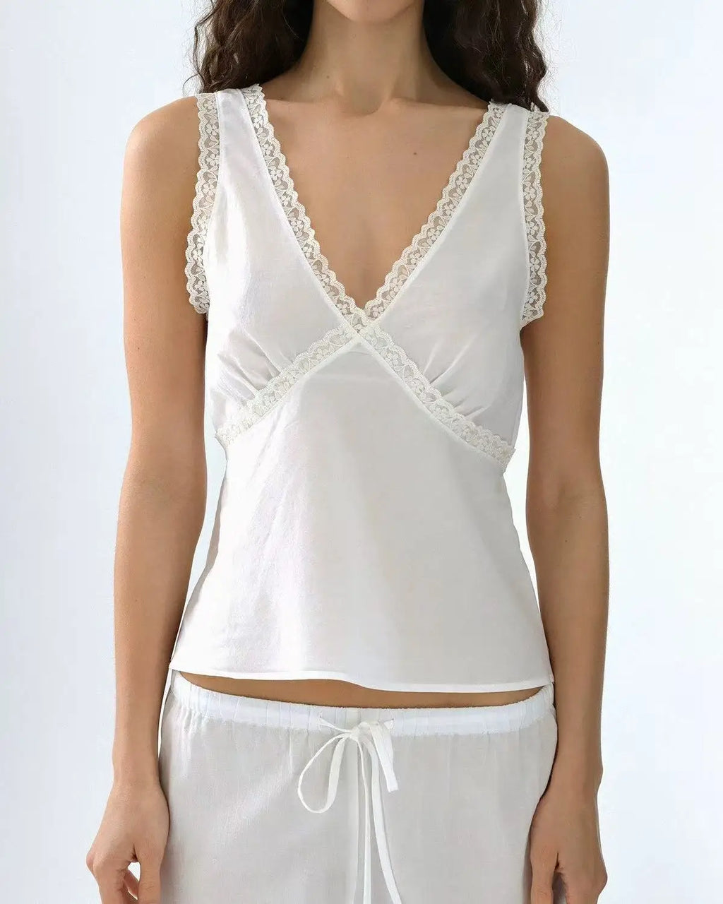 Coucou Black and white lace V-neck crop top and simple elegant straight-leg pants