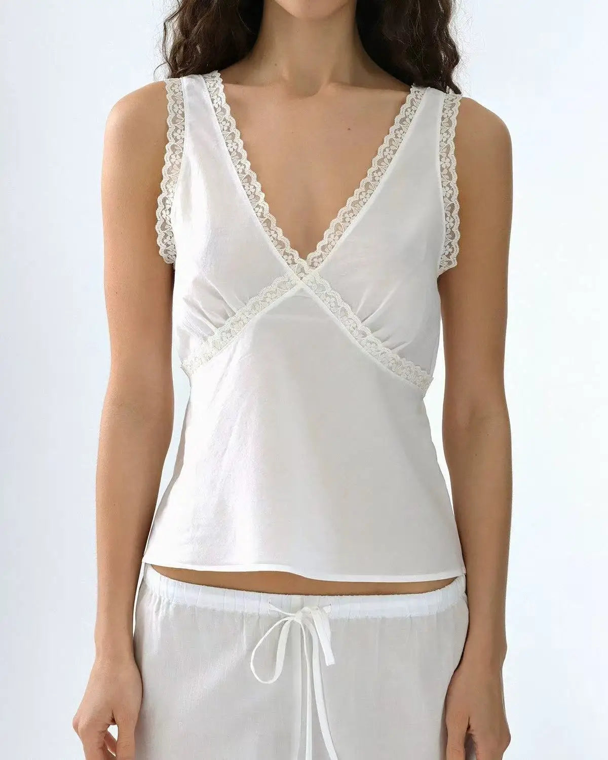 Coucou Black and white lace V-neck crop top and simple elegant straight-leg pants