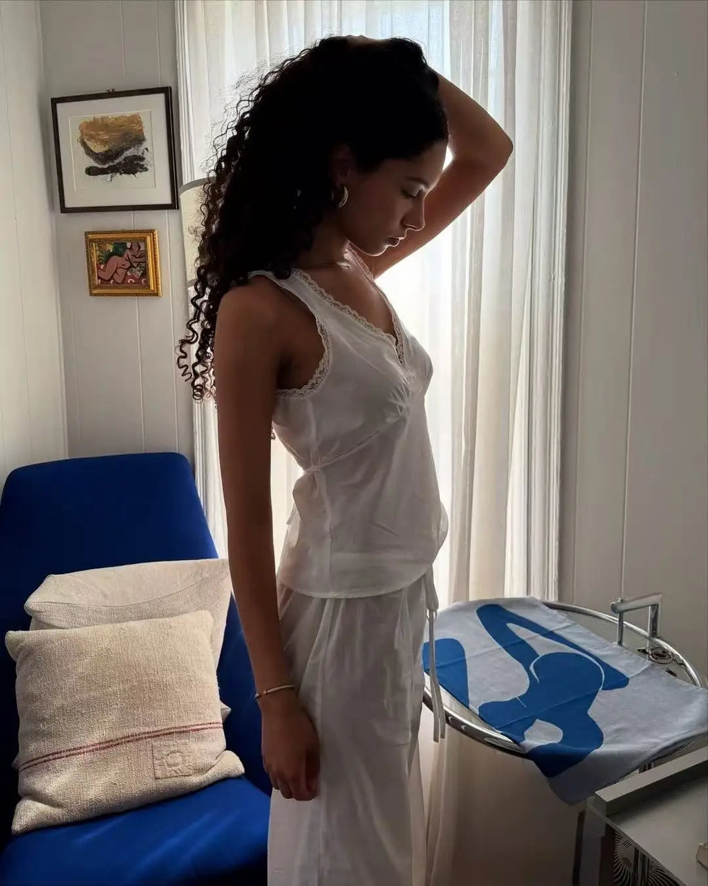 Coucou Black and white lace V-neck crop top and simple elegant straight-leg pants