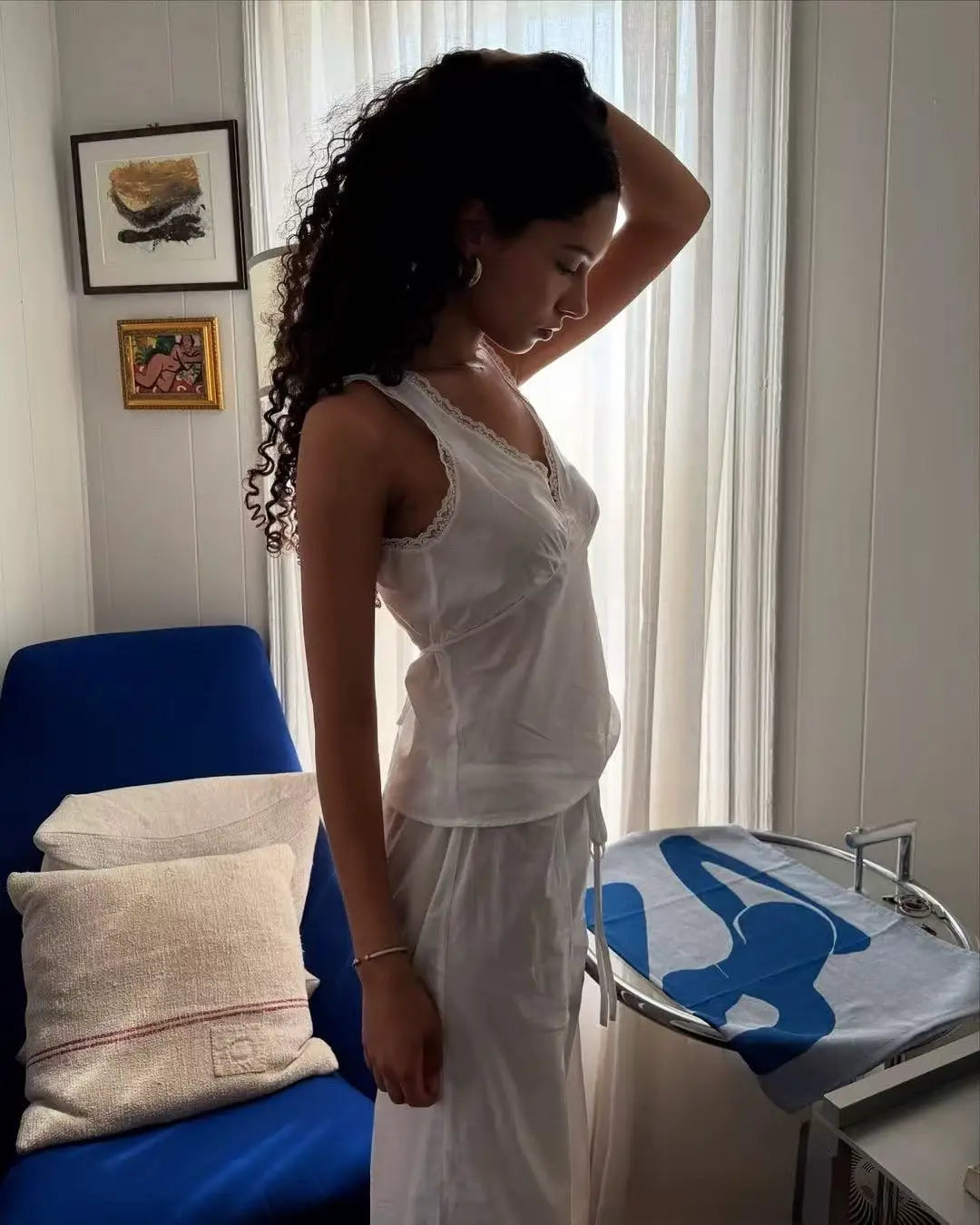 Coucou Black and white lace V-neck crop top and simple elegant straight-leg pants