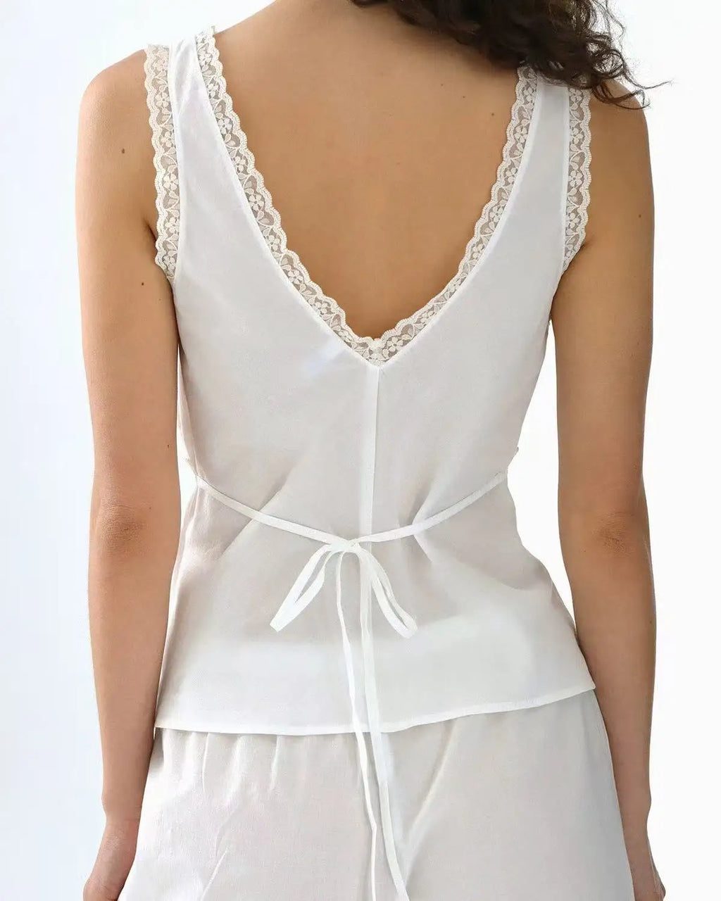 Coucou Black and white lace V-neck crop top and simple elegant straight-leg pants