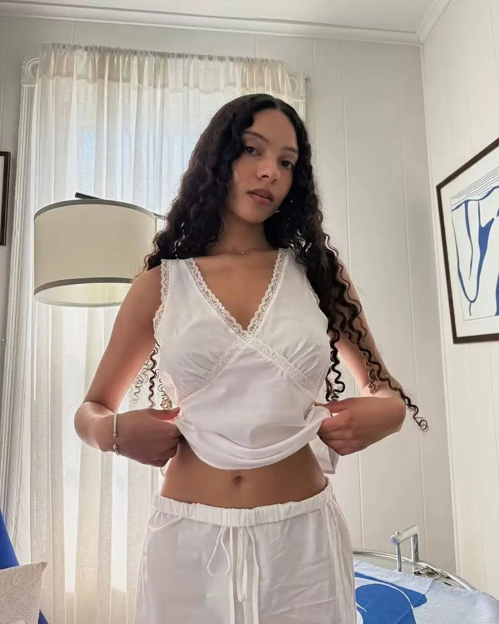 Coucou Black and white lace V-neck crop top and simple elegant straight-leg pants