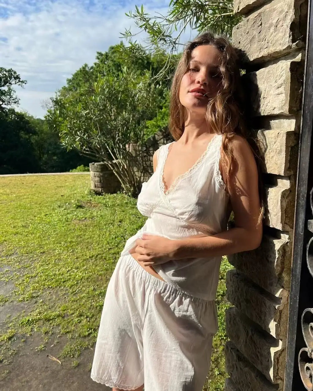 Coucou Black and white lace V-neck crop top and simple elegant straight-leg pants