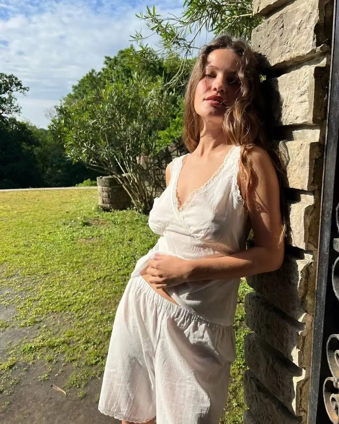 Coucou Black and white lace V-neck crop top and simple elegant straight-leg pants