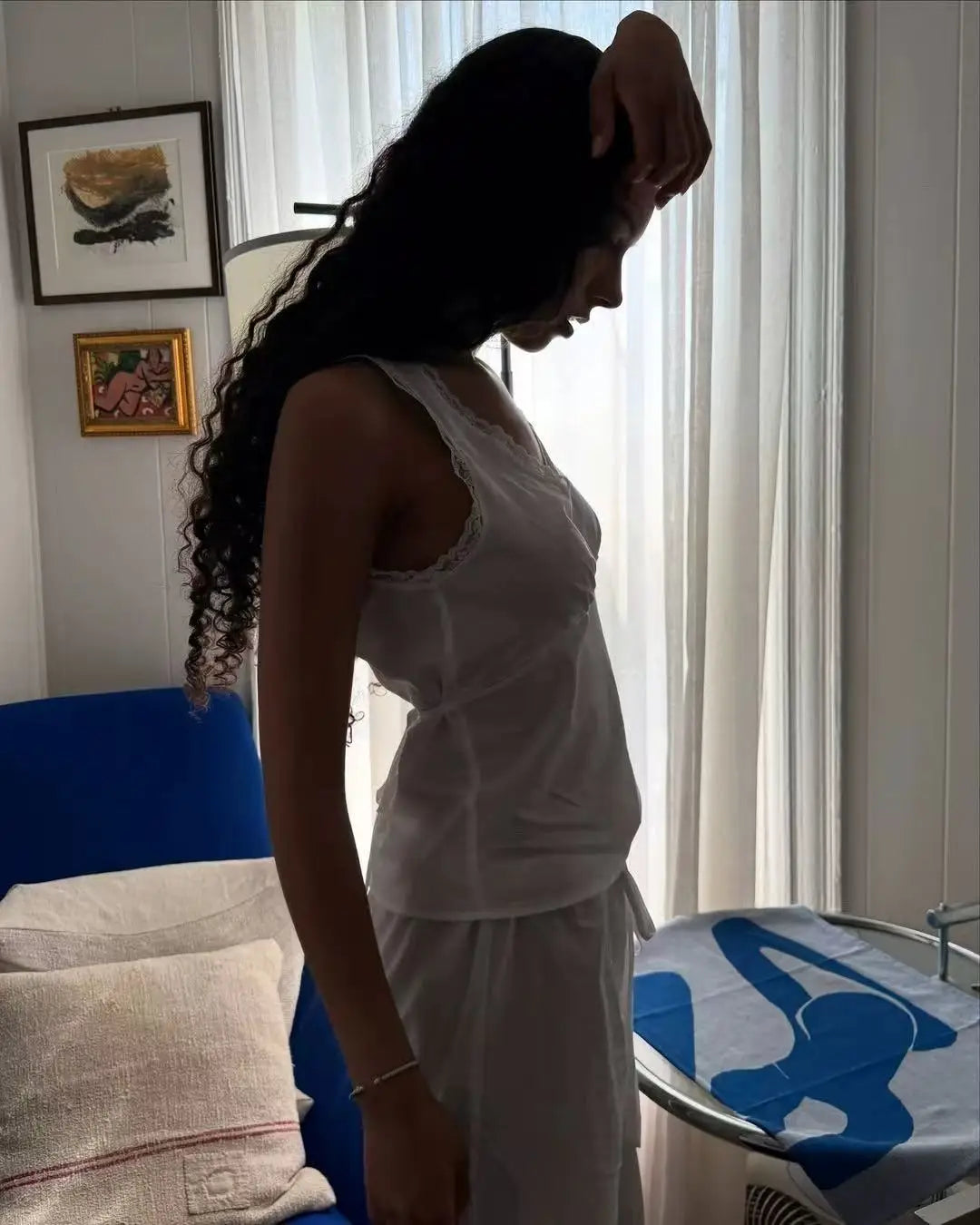 Coucou Black and white lace V-neck crop top and simple elegant straight-leg pants