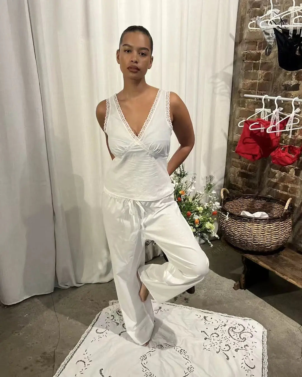 Coucou Black and white lace V-neck crop top and simple elegant straight-leg pants